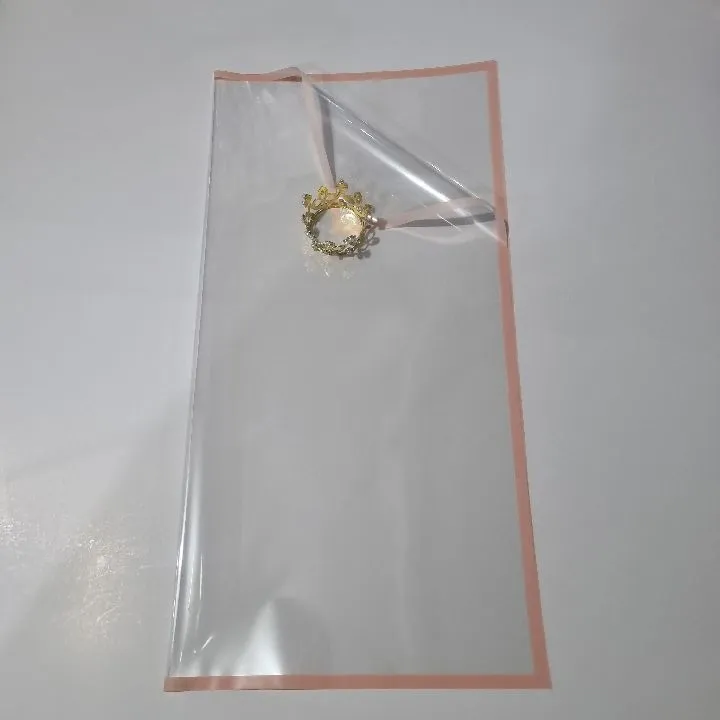 UNIDAD PAPEL COREANO TRANSPARENTE CON BORDE ROSADO