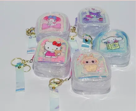 CLEVER - MONEDERO CON MIRELLAS + LLAVERO MUNDO SANRIO DISEÑOS SURTIDOSSA5899