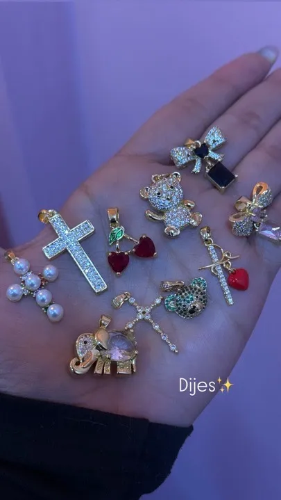 dijes elefante cruz y moños