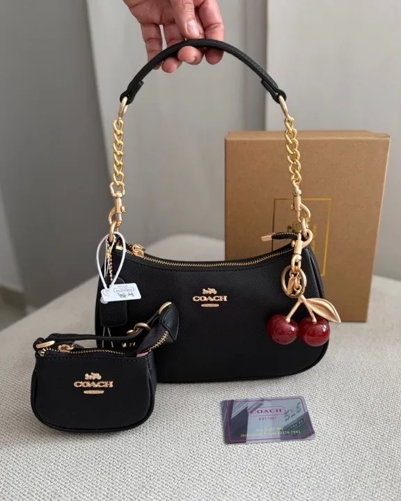bolso coach negro con mini bolsito