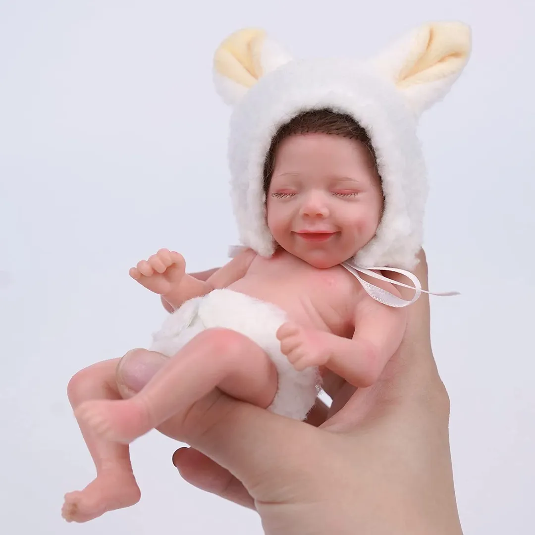 Mini Bebe Reborn (Conejito amarillo, dormida y sonriente) - Tienda de Angels